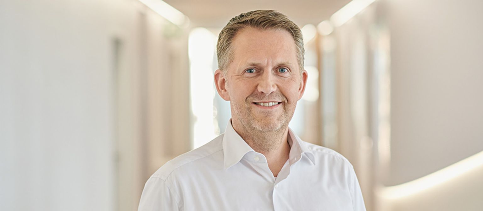Andreas Kropp, member of the EOS Group’s Board of Directors responsible for Germany<br/>is smiling. 